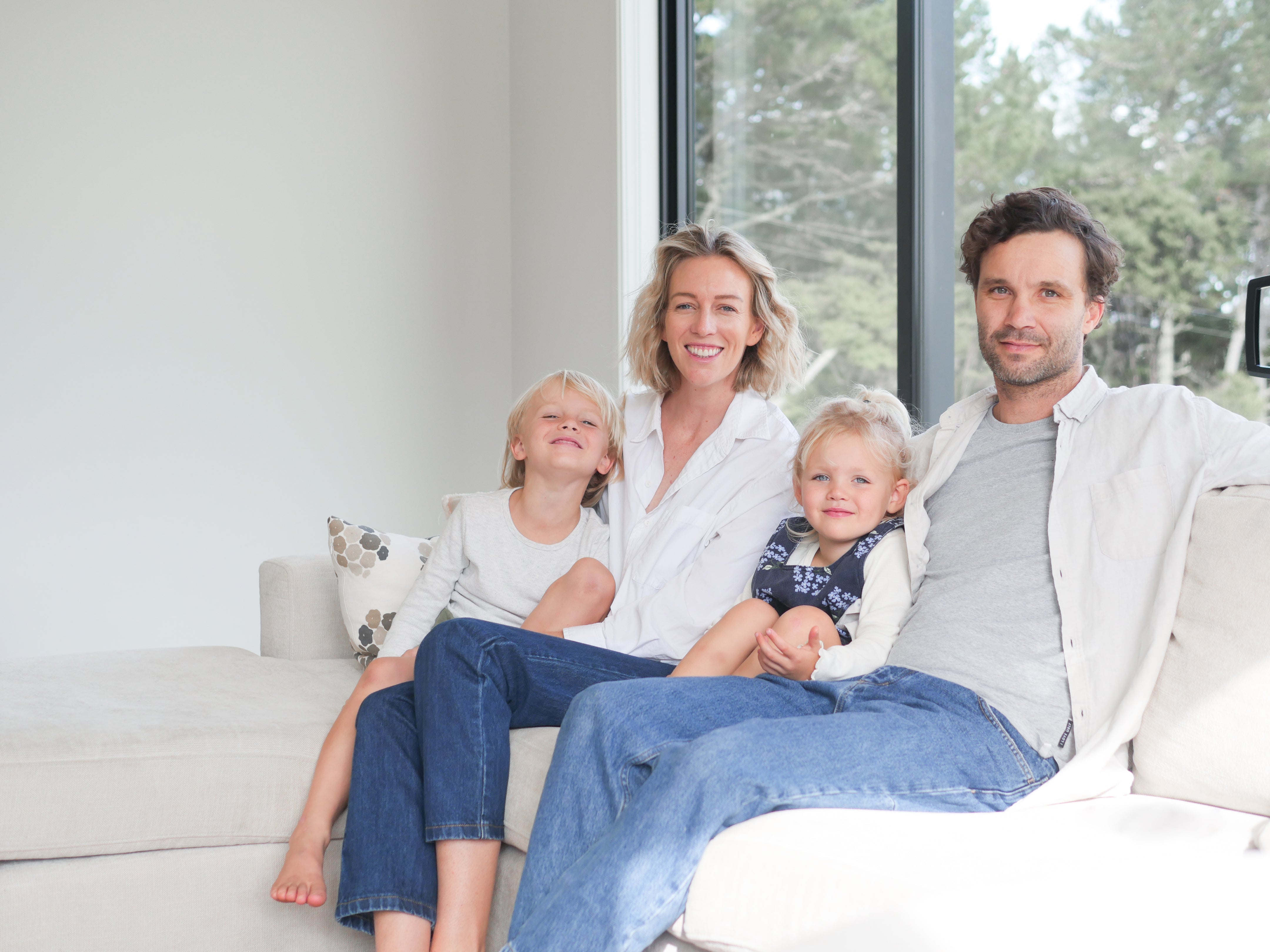 Happy family sitting on a couch